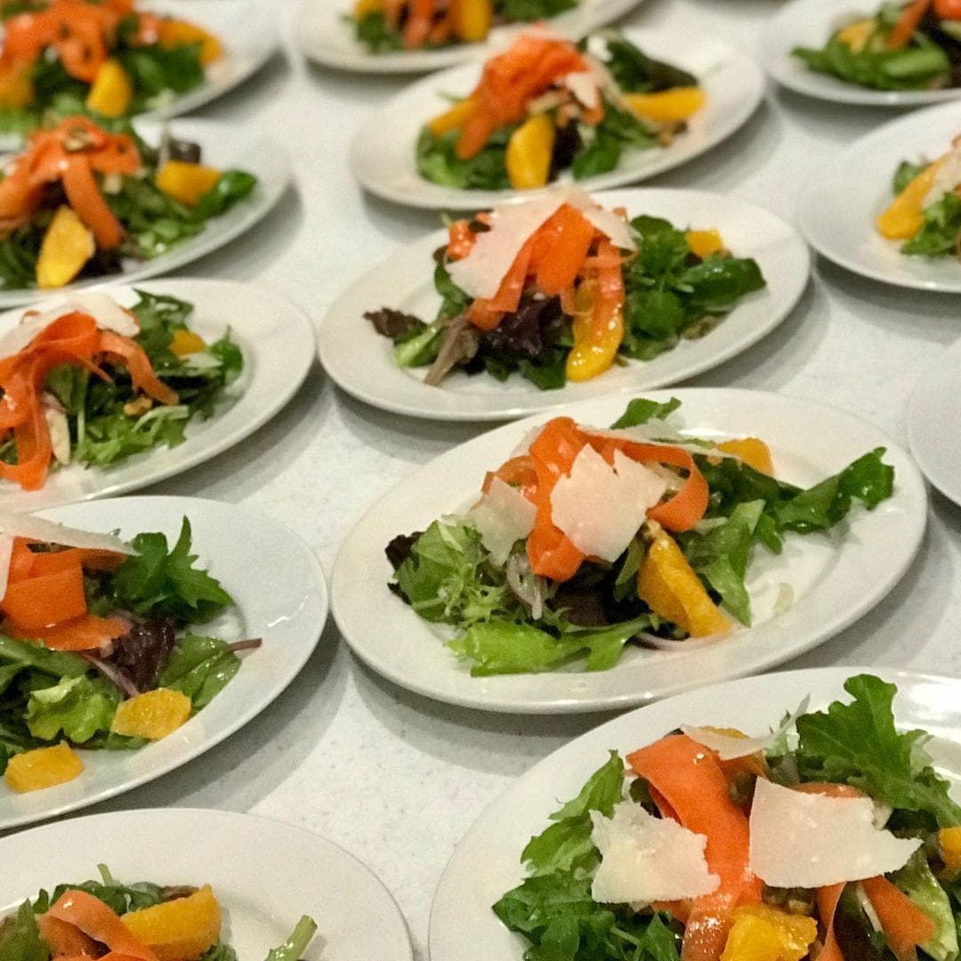 A table with many plates of food on it